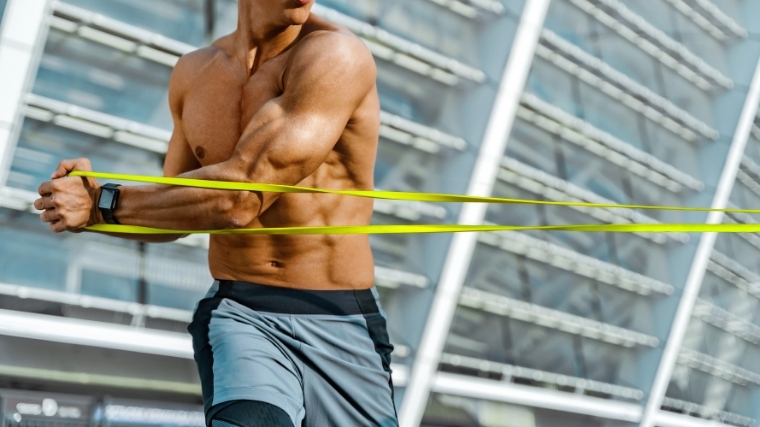 Man rotating with resistance band