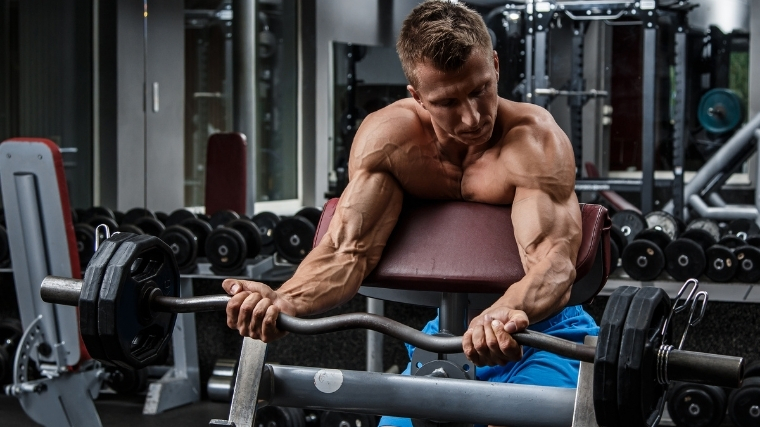 Man performing preacher curl