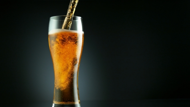 beer being poured into glass