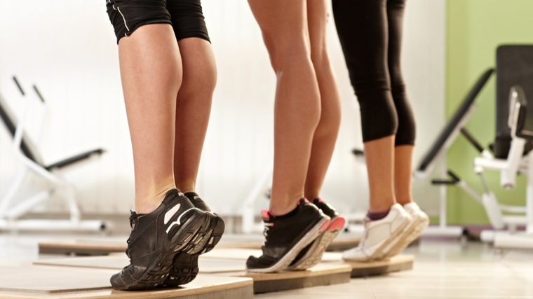 trio doing calf raise 