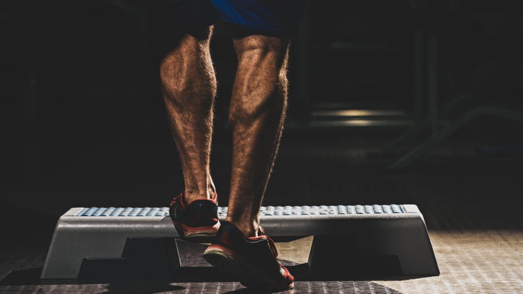 man setting up for calf raise 