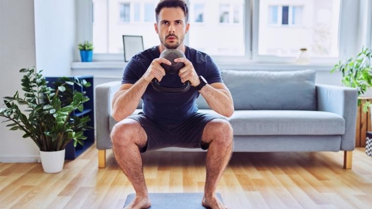 man doing a kettlebell goblet squat