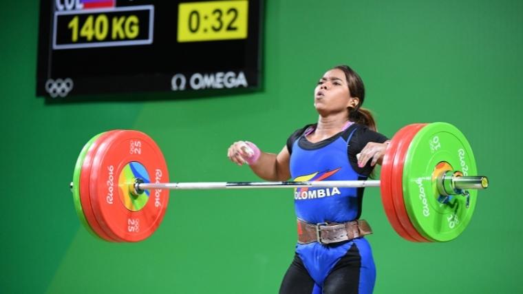 Colombian weightlifter at the 2016 Olympics dropping a barbell from overhead