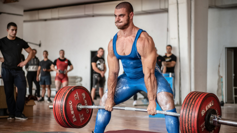 powerlifter performing sumo deadlift