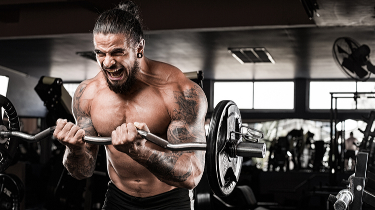 man performs barbell curl