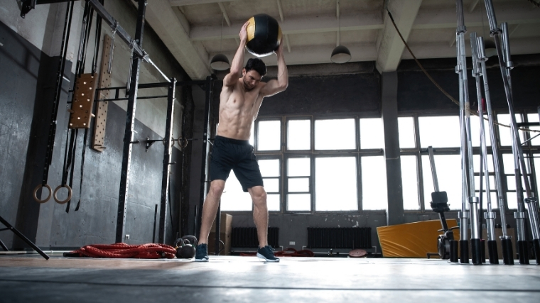 MAn slamming medicine ball