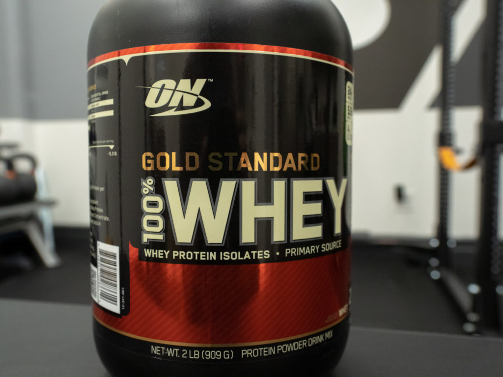 A container of Optimum Nutrition Gold Standard at the BarBend garage
