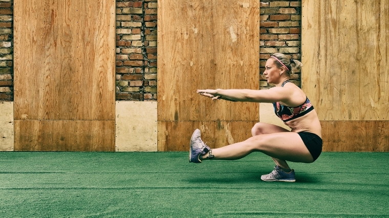 woman pistol squatting