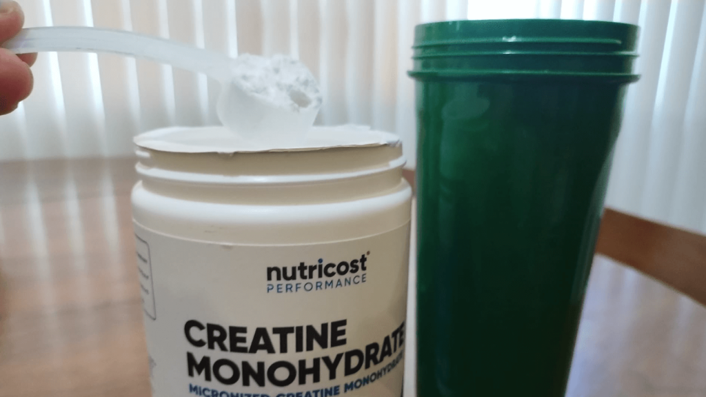 A scoop of Nutricost Creatine Monohydrate.