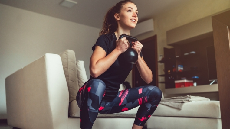 woman doing kettlebell goblet squat