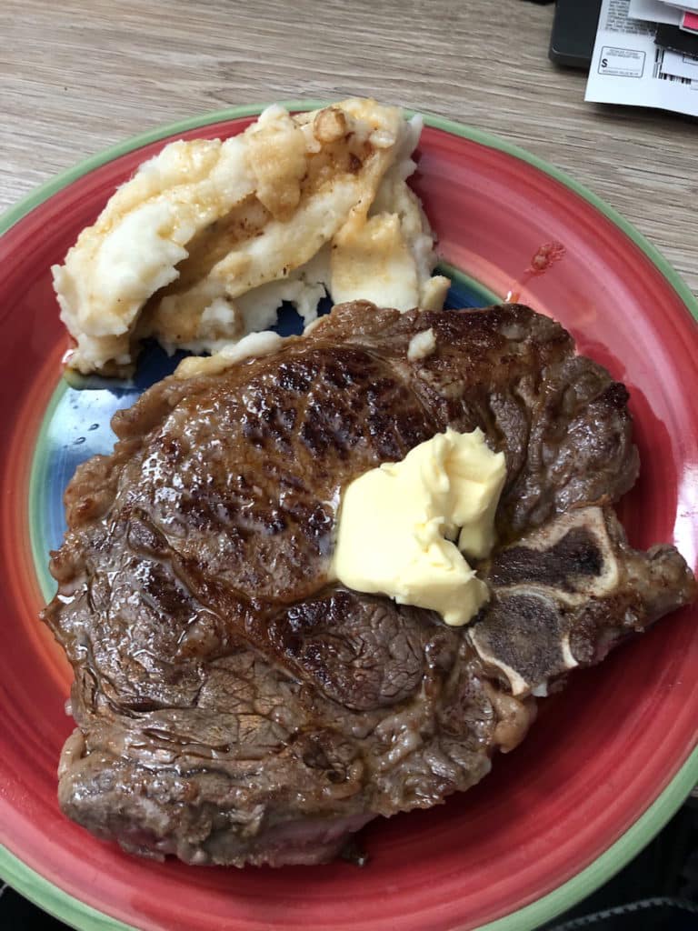 A plate of grass fed beef and potatoes