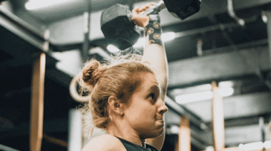 Athlete Completing Dumbbell Snatch