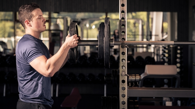 Man loading barbell