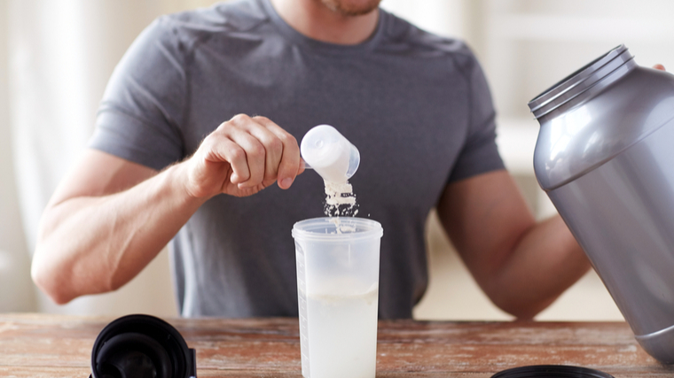 man pouring whey 