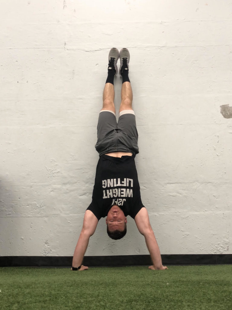 Handstand Push-Up (HSPU) Exercise Guide | BarBend