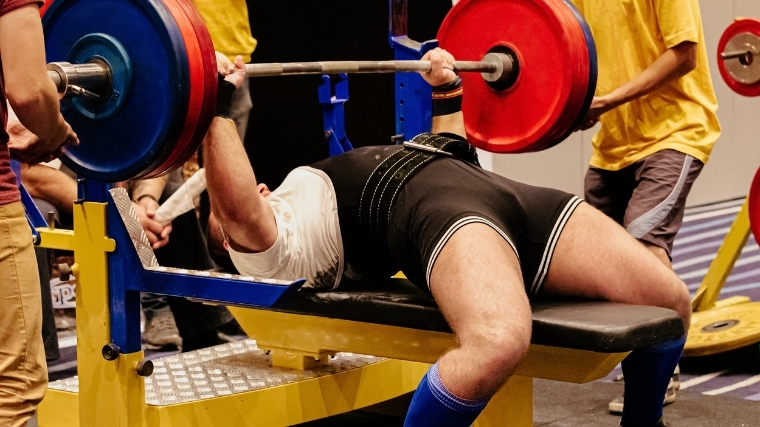 Man performing bench press