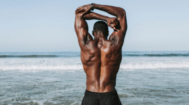 Man stretching upper back muscles