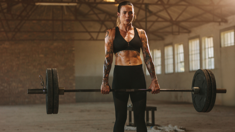 woman locking out deadlift