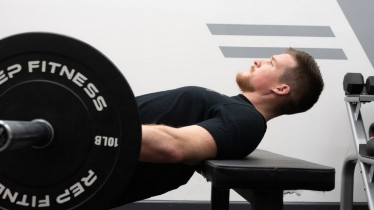 Man Setting Upper Back on Bench