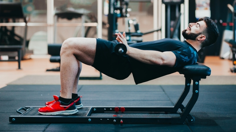 Man doing barbell hip thrust