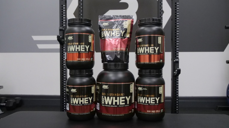 Stack of Optimum Nutrition Whey Protein flavors