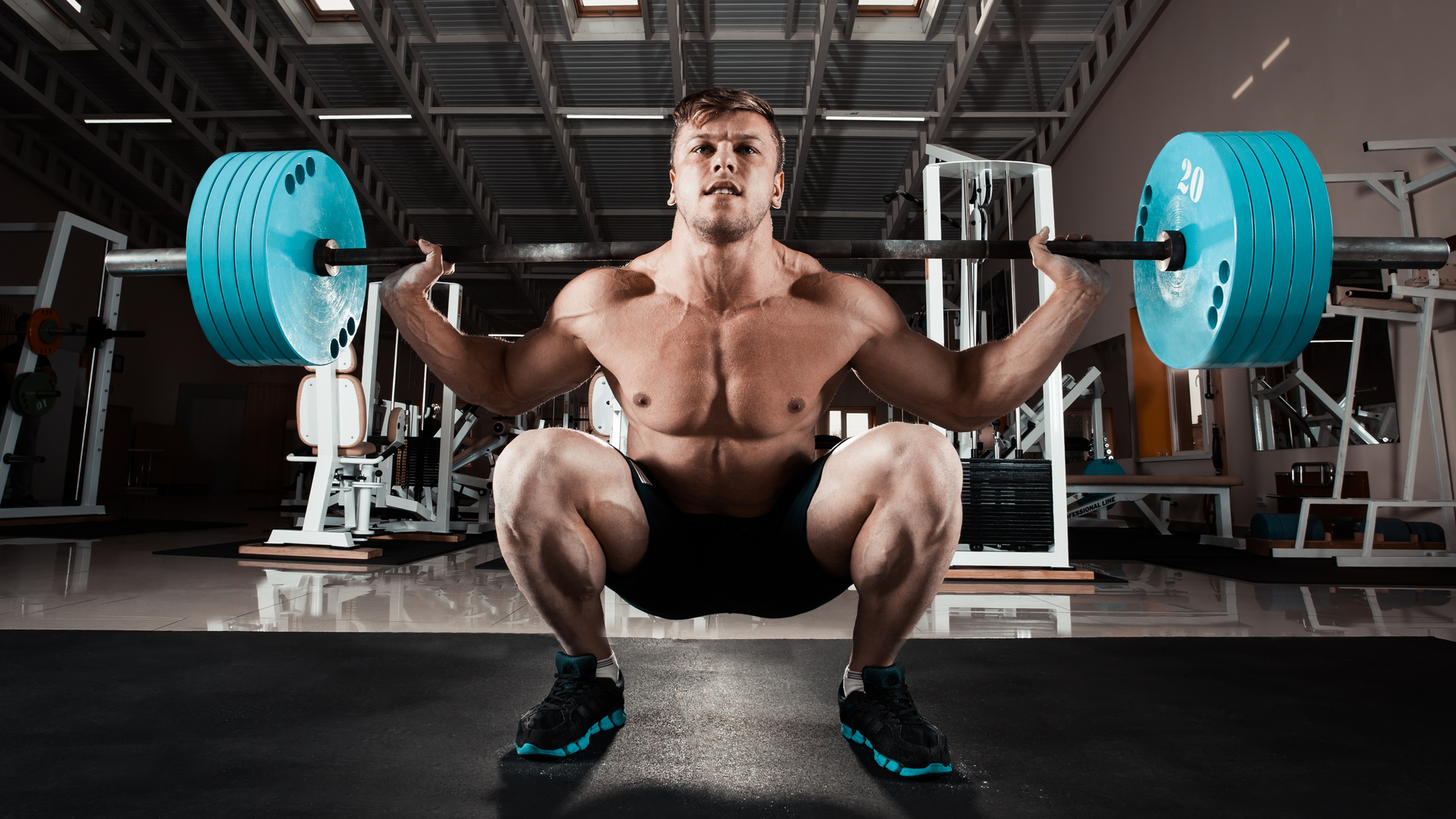 Athlete bracing his core during a squat