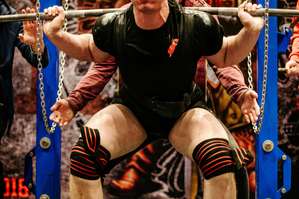 Powerlifter bracing his core during a squat