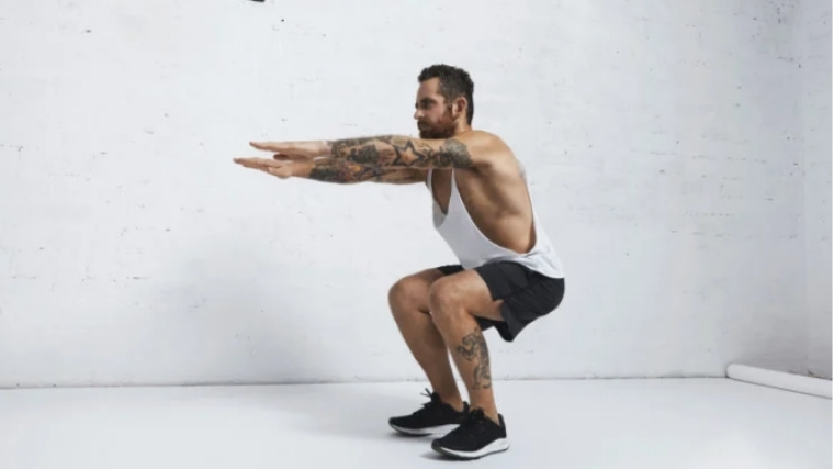 Man doing air squats