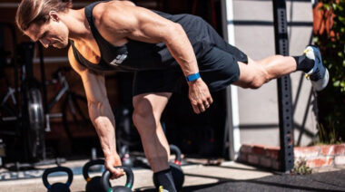 Man lifting with WHOOP strap on