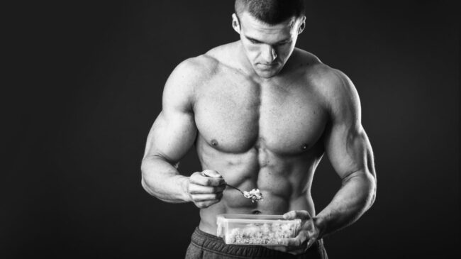 A muscular person eating to gain muscle mass.