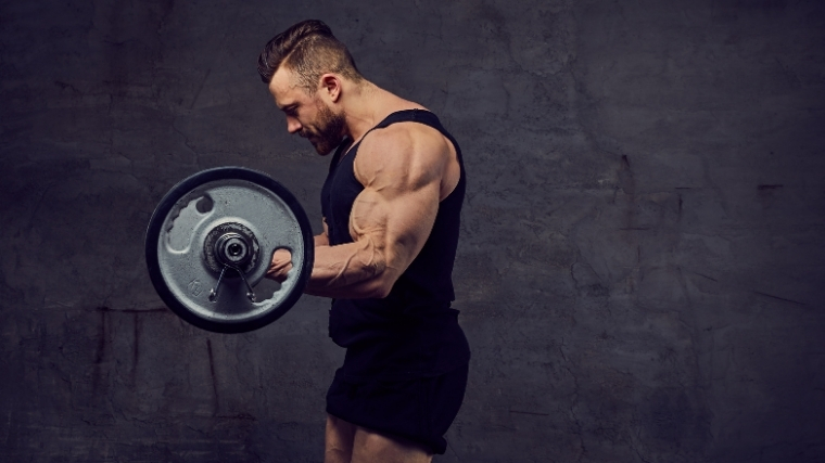 Man performing barbell curl