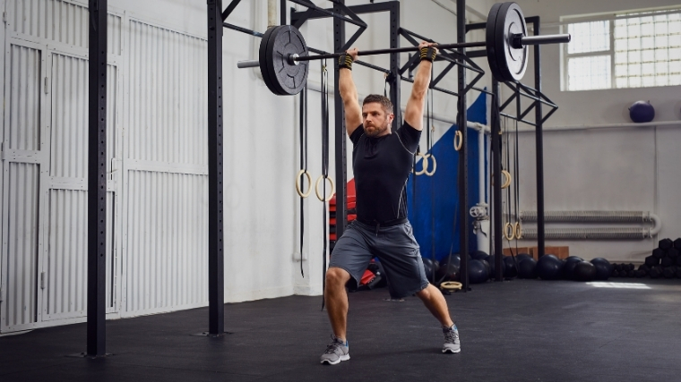 Man performing clean and jerk