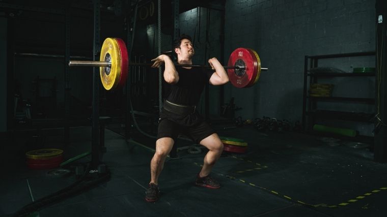 Man performing power cleans