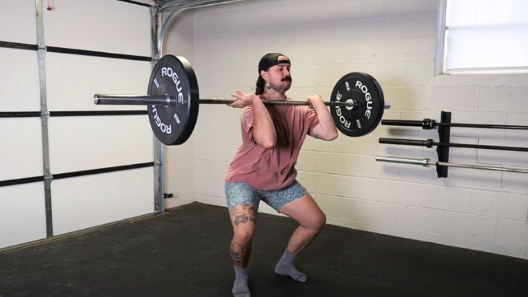 A person performing the power clean exercise.