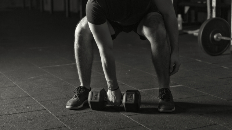 Man snatching dumbbell