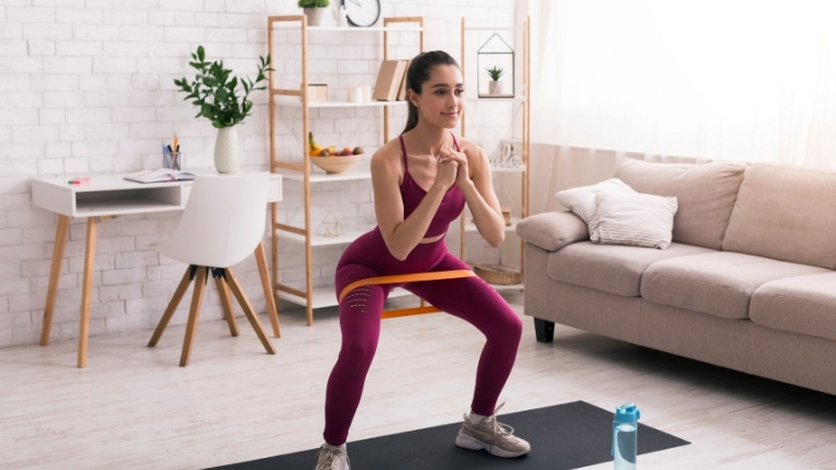 Woman working out with mini band