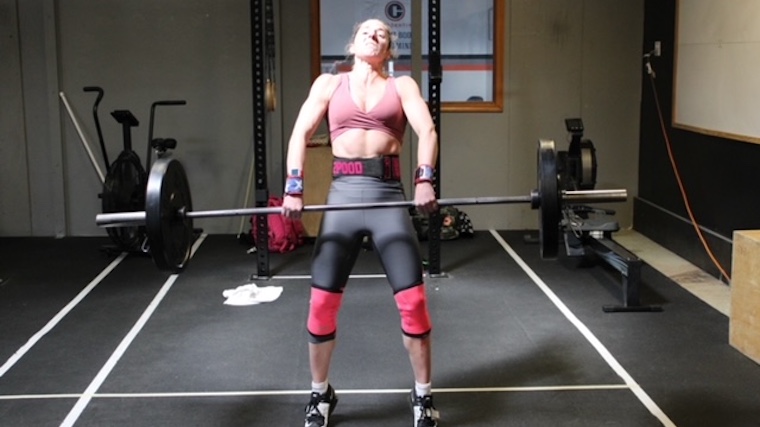 Kimberley Dekeyrel Cleaning a Barbell