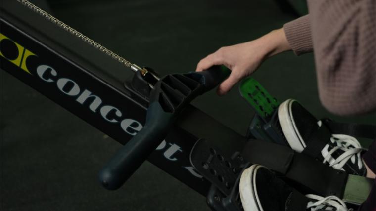 Our tester gripping the handle on the Concept2 RowErg.