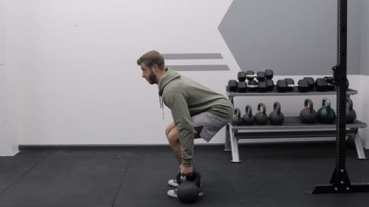 Suitcase squats with discount dumbbells