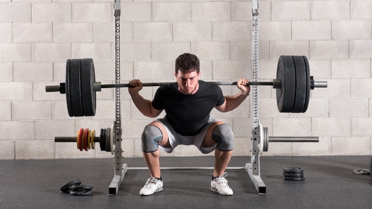 Man doing back squat