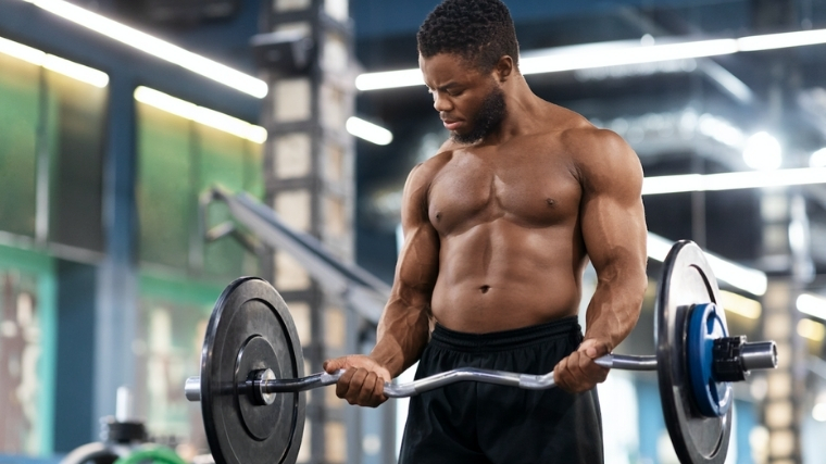 Man curling an EZ-Bar