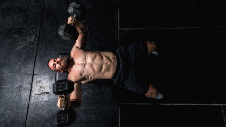 Man performing dumbbell press