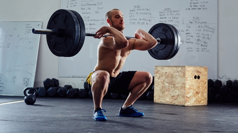 Man front squatting