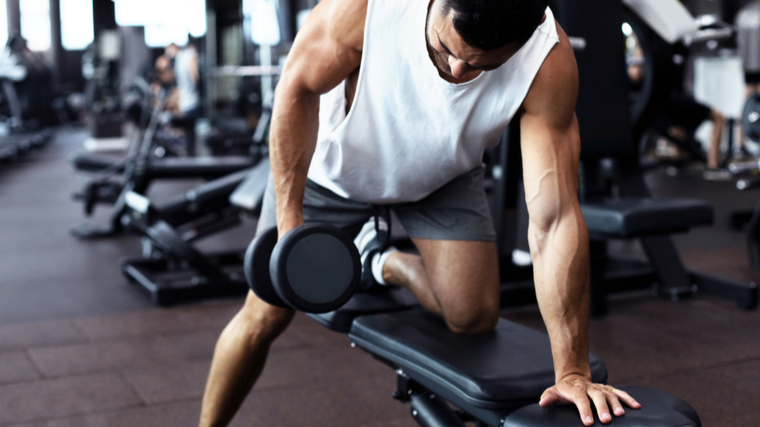 man doing dumbbell row 