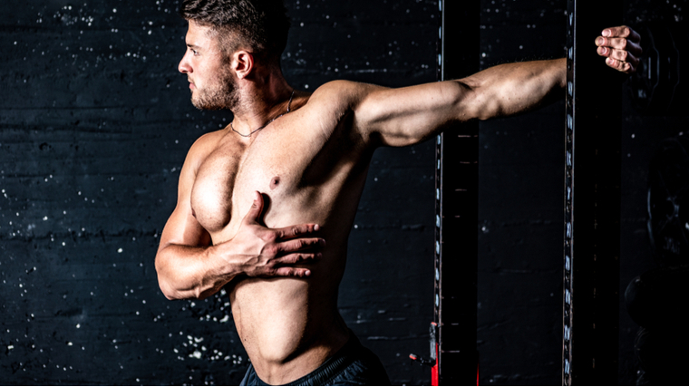 man doing pec stretch 