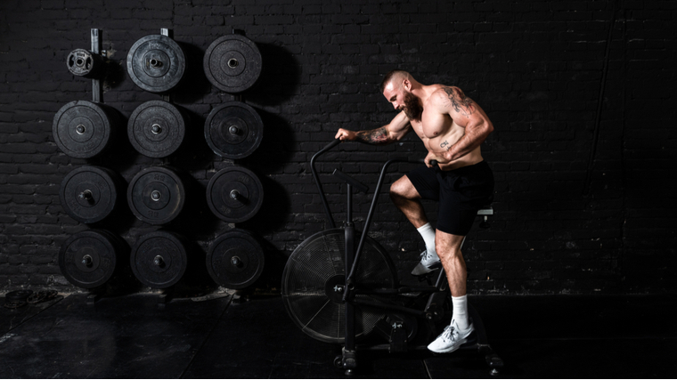 man doing stationary bike cardio 