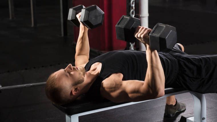 man doing dumbbell bench 