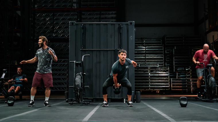 Man swinging kettlebell