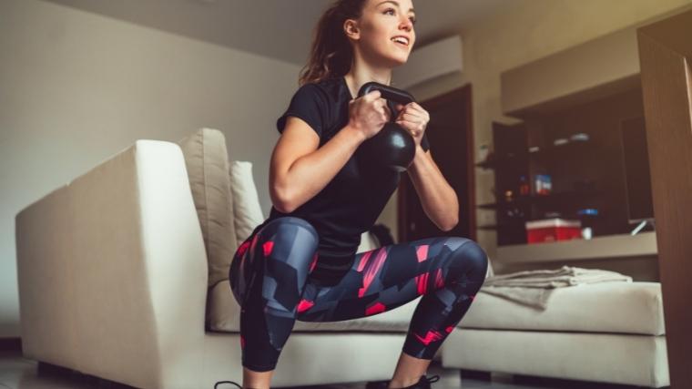 Woman performing kettlebell goblet squat