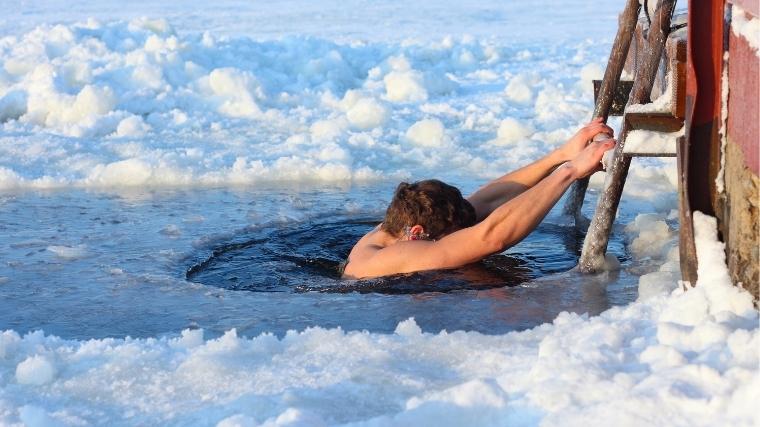Man plunging into cold water